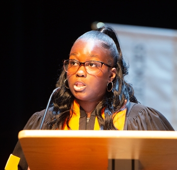 Student speaking at a podium